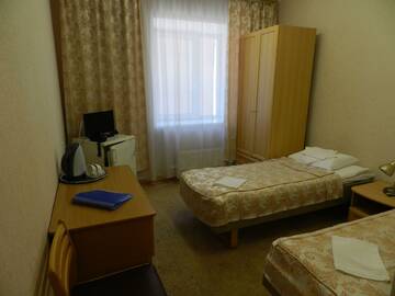 Фото номера Номер стандарт с 2 односпальными кроватями Гостиница Губернский г. Мурманск 4